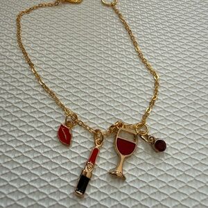 Chic Gold Bracelet with Red and Black Charms